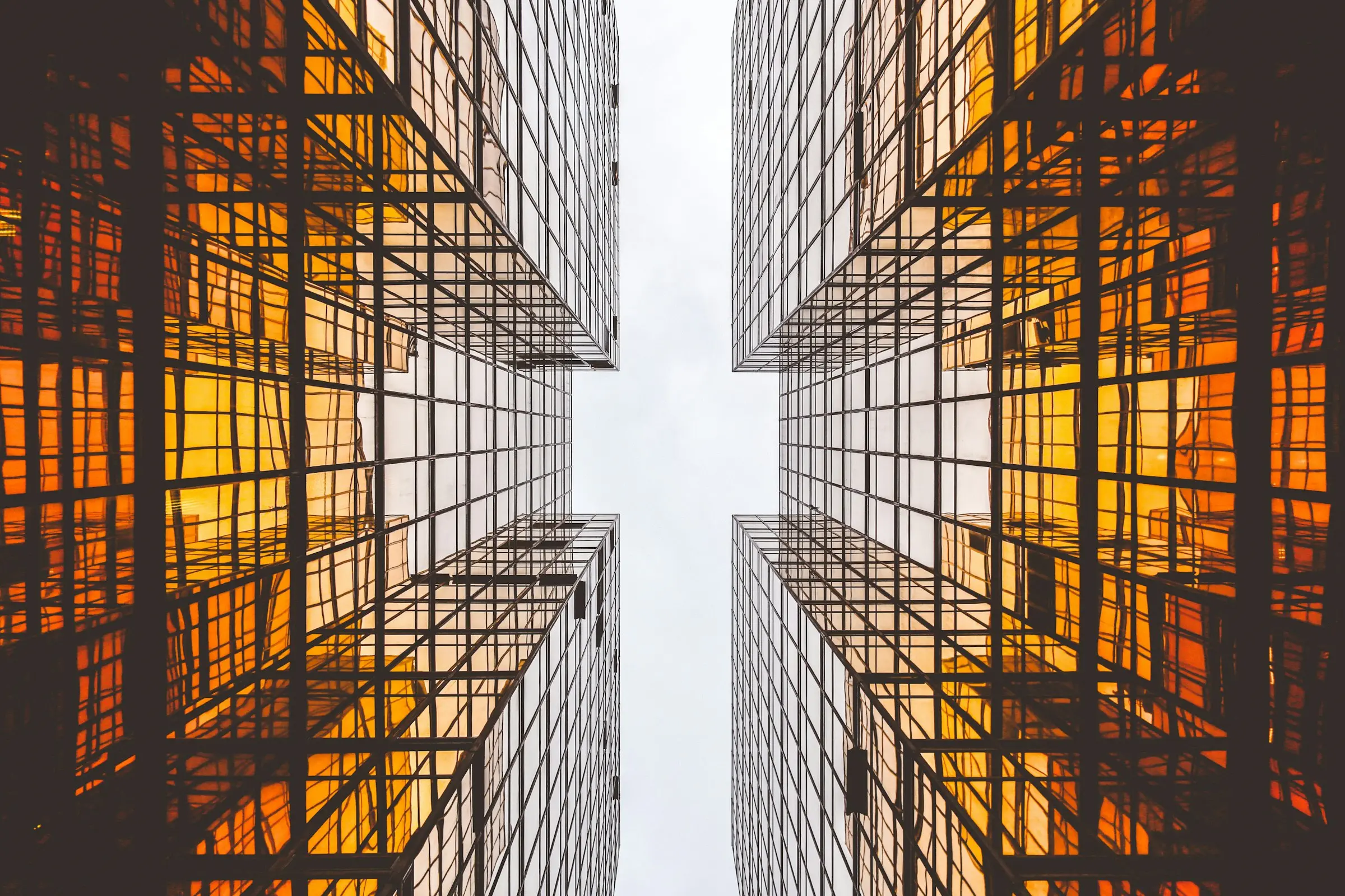 Looking up between two golden glass towers